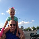 Emma on Daddy's shoulders at Turner Field